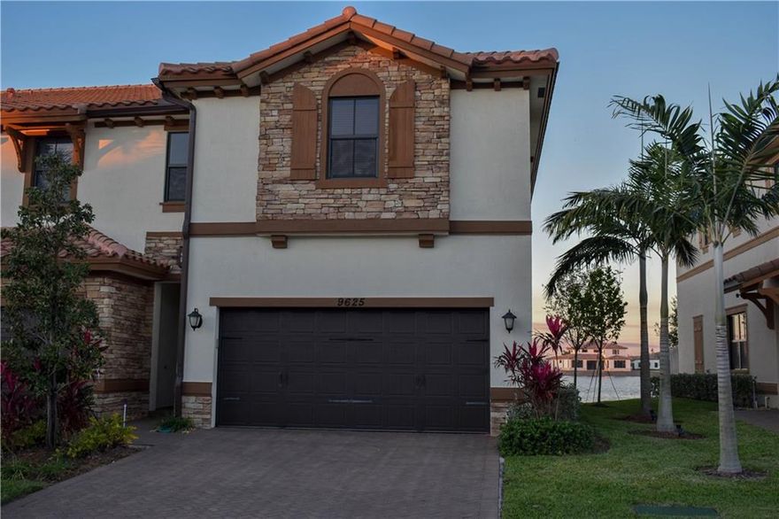 Come take a look at this beautiful townhouse in Parkland in Town Parc at Mira Lago. This is the best townhouse in Parkland with the best view over looking the largest lake in Broward County. Every upgrade you can imagine, including: plantation shutters, crown molding, 42" white cabinets w/ under cabinet lighting, sealed paver slab w/ fence, smart home ready and glass impact windows throughout. This is the most affordable way to buy new in Parkland! In addition you get use of the state of the art clubhouse
