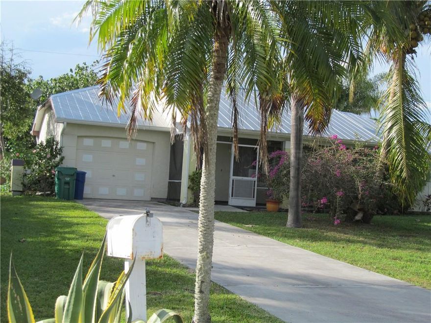 Perfect starter, retirement, or investment home. New metal roof 2016, updated kitchen-new counters & good stainless steel appliances. Bathrooms previously upgraded.With new lving room flooring(carpet needs replacement), some fresh paint, minor repairs it is ready to move into or rent. Beautifully high (no flood zone) well landscaped 10,000 sq.ft. lot it has the Cocnuts just bring your lime.  2 Bedroom, 2 bath home, plus 1 car garage with laundry & Maytag washer/dryer, scrrened covered front porch, large open rear patio. Sellers priced for fast sale. Cash buyers  preferred, expected to sell soon with quick closing. Perfect starter, retirement, or investment home. New metal roof 2016, updated kitchen-new counters & good stainless steel appliances. Bathrooms previously upgraded.With new lving room flooring(carpet needs replacement), some fresh paint, minor repairs it is ready to move into or rent. Beautifully high (no flood zone) well landscaped 10,000 sq.ft. lot it has the Cocnuts just bring your lime.  2 Bedroom, 2 bath home, plus 1 car garage with laundry & Maytag washer/dryer, scrrened covered front porch, large open rear patio. Sellers priced for fast sale. Cash buyers  preferred, expected to sell soon with quick closing. Next available showing day this Sunday 27th 11am-4pm All offers to be presented after open house.