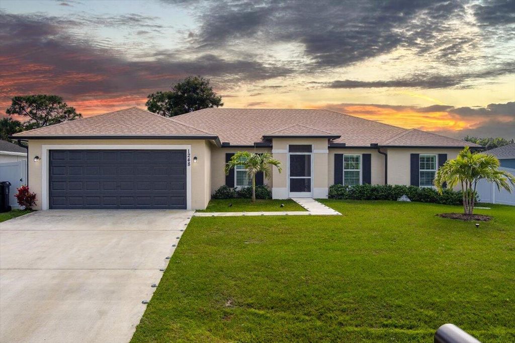Photo of 1248 SW Mancuso Avenue, Port Saint Lucie, FL 34953 (MLS # R10959475)