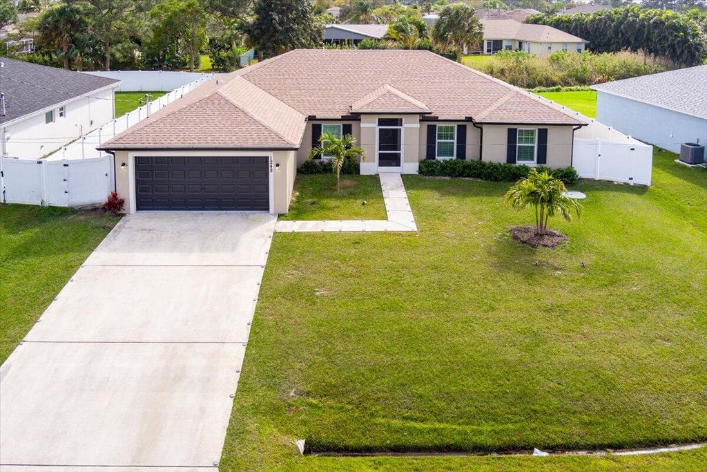 Photo of 1248 SW Mancuso Avenue, Port Saint Lucie, FL 34953 (MLS # R10959475)
