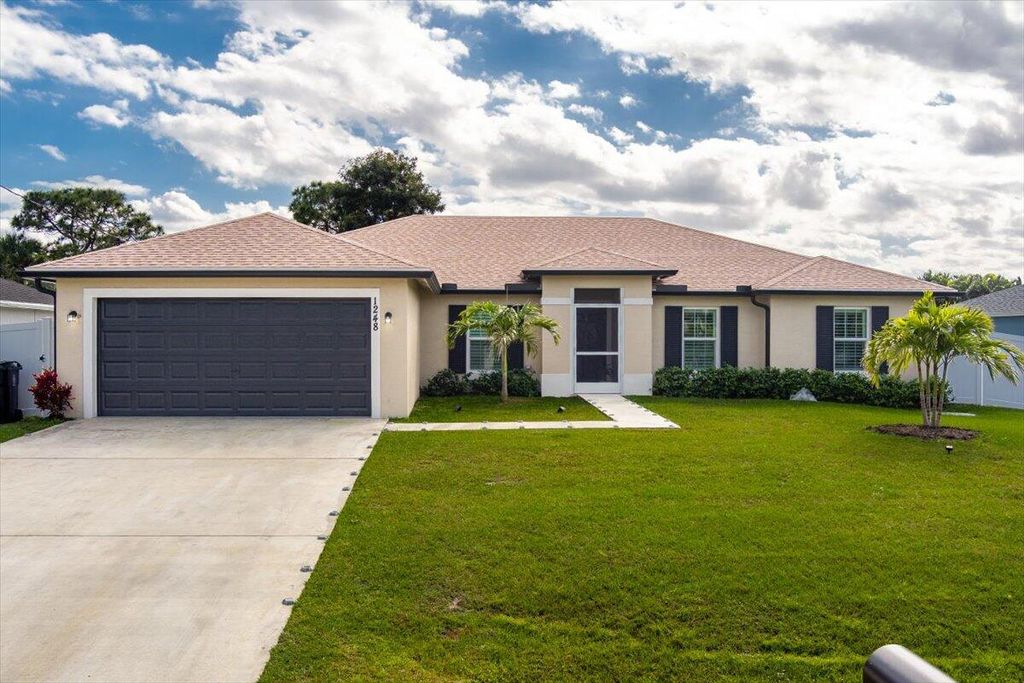 Photo of 1248 SW Mancuso Avenue, Port Saint Lucie, FL 34953 (MLS # R10959475)