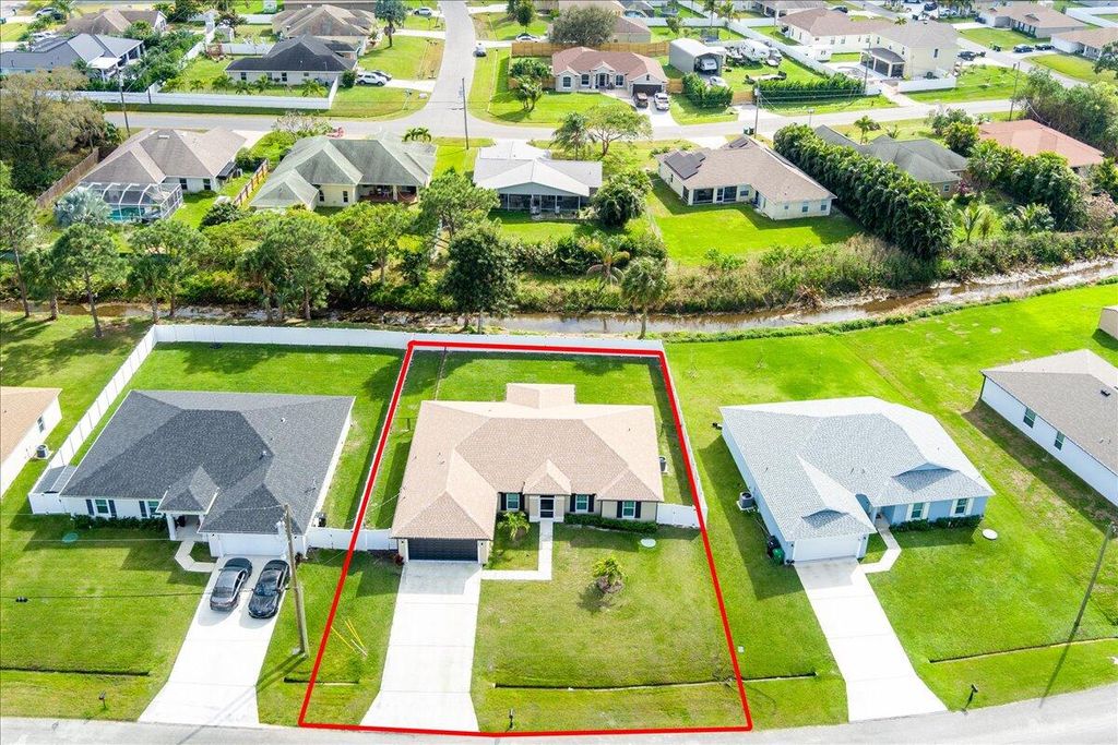 Photo of 1248 SW Mancuso Avenue, Port Saint Lucie, FL 34953 (MLS # R10959475)