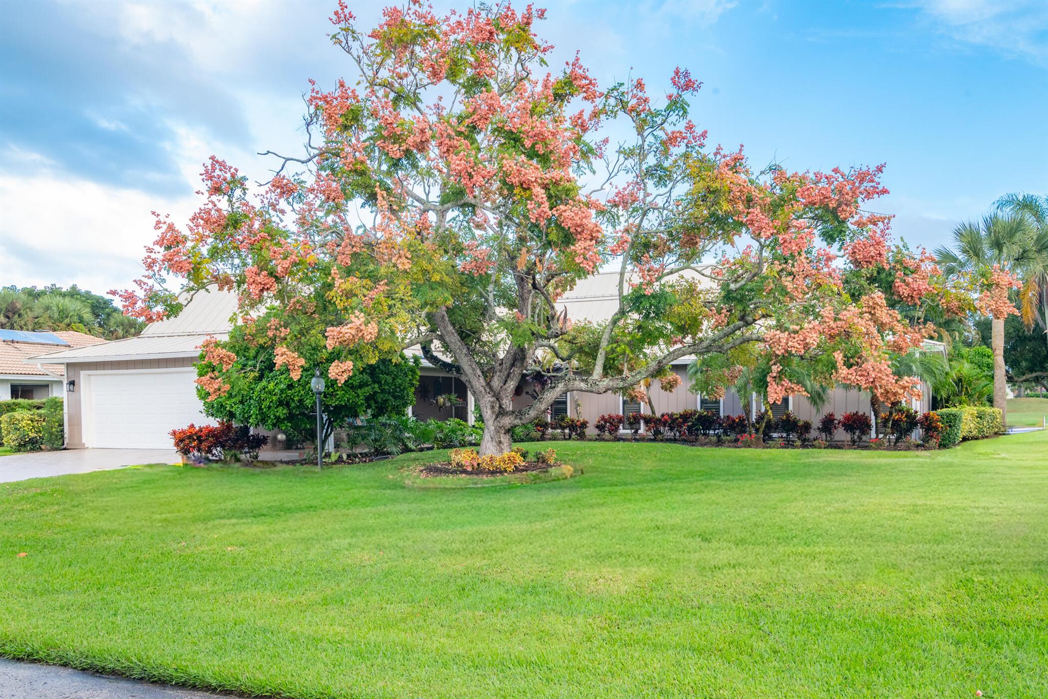 Welcome to YCC!  This particular 4 Bedroom, 4 Bath pool home boasts breathtaking golf course views and beautifully manicured landscaping.  The main level features the Owner's suite, a second en-suite with a cabana bathroom, a third bedroom and an additional full bathroom.  Upstairs, a spacious and private loft which could be an office or a 4th bedroom with full bath.  This upstairs has a separate spiral staircase entrance which would be perfect for guests or a home office.Florida living at it's best with an in-ground pool, manicured fenced in lawn area in back yard, perfect for your pet!  Yard has Dwarf Mangos trees, fig & avacodo too!Yacht & Country club is a gated community with Golf, Tennis and social memberships available but not mandatory!  Dining room chandelier does not con