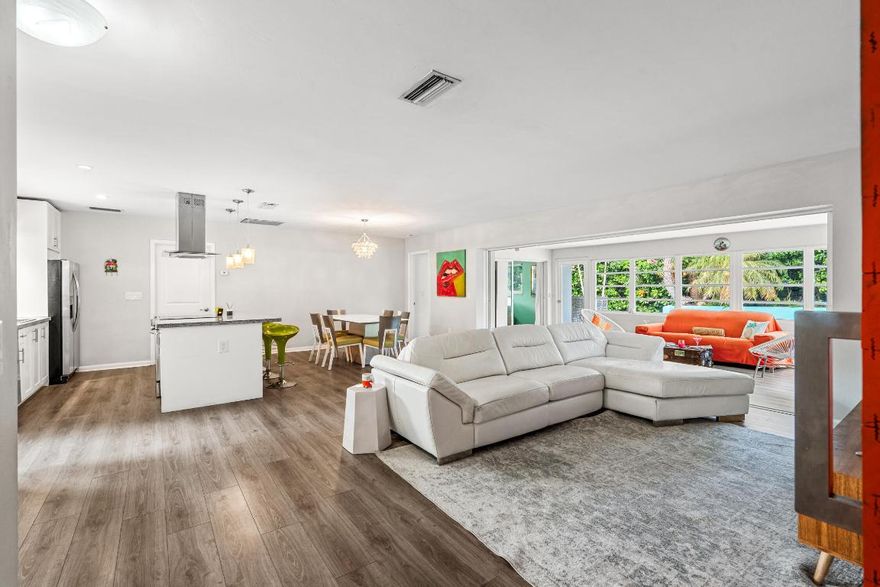 Updated 3BR/2BA mid-century pool home in the sought-after waterfront community of Hypoluxo Shores, just steps from the Intracoastal. This single-story home features a split floor plan, open living spaces, and a Florida room overlooking a private tropical backyard.

Recent upgrades include impact windows and doors (2022), new roof (2023), and new HVAC (2024). The kitchen offers granite countertops, stainless steel appliances, and ample storage, with laminate flooring throughout the main living areas.

Enjoy a fenced backyard with a heated pool, spa, and lush landscaping, perfect for relaxing or entertaining. Quiet dead-end street location close to beaches, shopping, dining, and major highways. Move-in ready with all major updates completed.