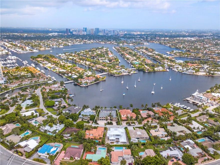 This luxurious estate is situated on one of the most coveted waterfront locations in E. Ft Lauderdale. Breathtaking panoramic waterway views from almost every room with luminous open living spaces & volume ceilings. Palatial master suite & custom closets. Seamlessly integrated indoor/outdoor living spaces capture the true essence of the S. Florida lifestyle. The full summer kitchen & covered loggia overlook the infinity edge pool & spa. Ideal for the avid yachtsman only mins to the ocean. Sq ft from Imapp