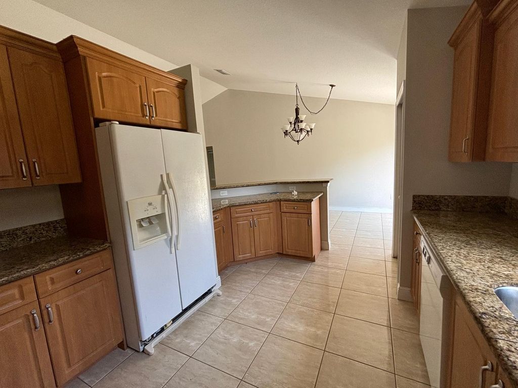 Photo of 1341 SW Oriole Lane, Port Saint Lucie, FL 34953 (MLS # R10987009)