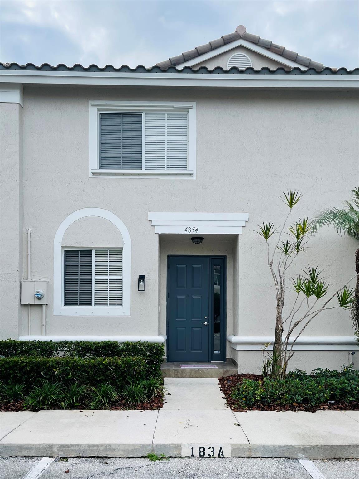Spacious well maintained two bedroom two and a half bathroom townhome in highly sought after gated community of Victoria Isles. Community provides controlled access points and is patrolled by security personnel,included are a clubhouse, a heated swimming pool, and a fitness center. Shopping and dining are a short drive from the Promenade at Coconut Creek, which offers numerous shops and restaurants. Conveniently close to major highways like the Sawgrass Expressway and the turnpike. Short distance to Deerfield and Pompano Beach. HOA maintained common areas and landscaping.