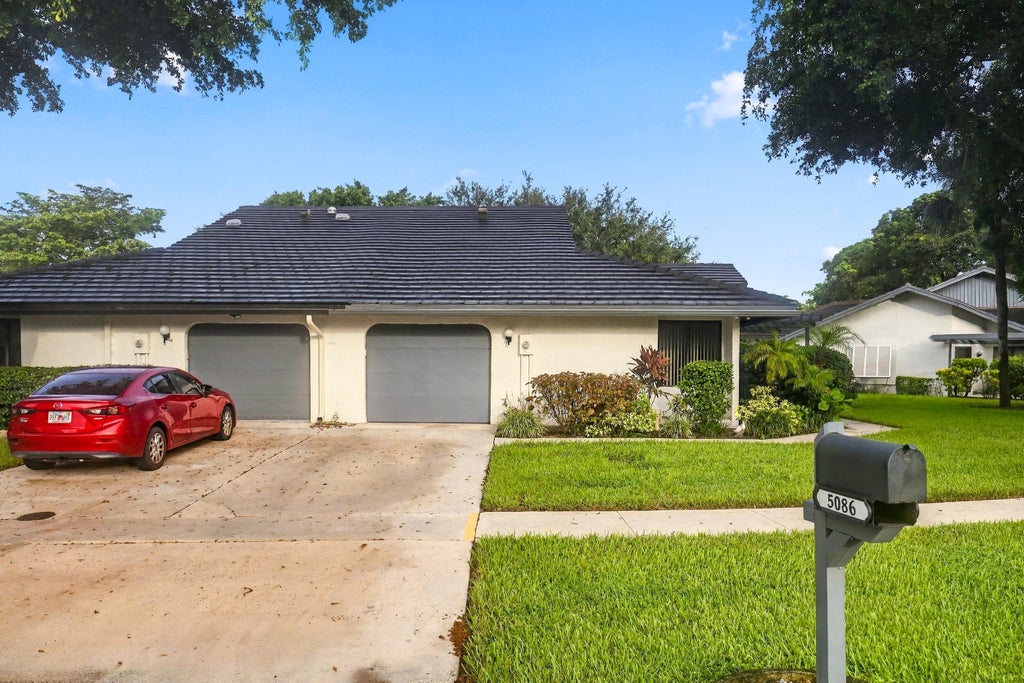 Photo of 5086 Pine Drive, Boynton Beach, FL 33437 (MLS # B26085800)