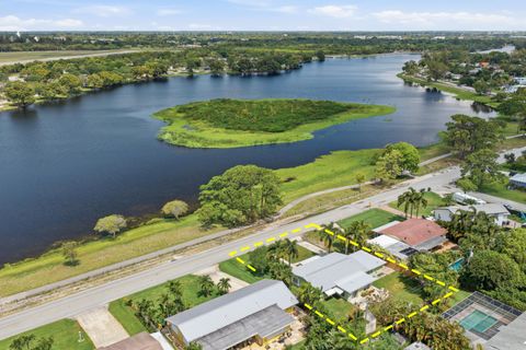 Photo of 5650 Lake Osborne Drive, Lake Worth, FL 33461 (MLS # B26018552)