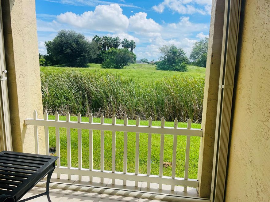 Charming Turnkey 1/1 Condo with private canal and golf view in gated community close to Equestrian facility.New kitchen and vanity bath. 1 car Garage steps away from unit.