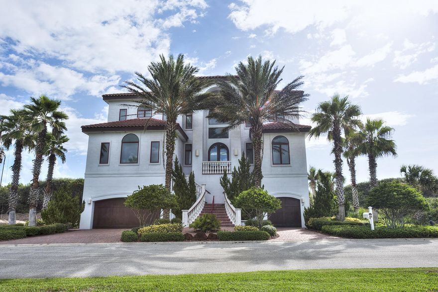 MOTIVATED SELLER! PRICED TO SELL! One-of-a-kind custom oceanfront estate inspired by the Amalfi Coast in Italy on the exterior & the Guggenheim Museum on the interior! No detail or expense was spared in the concept, design, build or maintenance of this oceanfront estate. You will be impressed from the grand entry of the prestigious Hammock Dunes, a private golf community to the impressive quality of finishes & features this home showcases. Imported Italian porcelain tile throughout with matching bullnose baseboards, Gourmet Kitchen featuring Sub Zero, Viking , Miele appliances, Imported Italian lighting throughout, just to name a few. PLEASE VIEW THE SELF-GUIDED 3D VIRTUAL TOUR FOR DETAILS! PLEASE ALSO READ THE SUPPLEMENTAL REMARKS FOR ALL CUSTOM FEATURES, BRAND NAMES & UPGRADES.