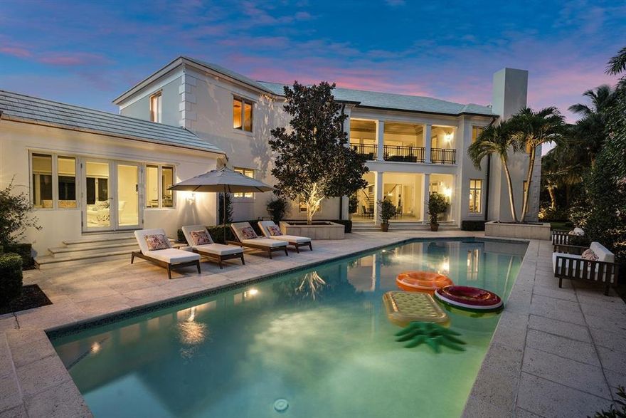 If you appreciate quality and craftsmanship, and want to live in one of south Florida's best small communities in an upscale location, this 5,300 SF 4 bedroom, 5.5 bath home on a large 2/3 acre lot is the perfect choice. Located on a large cul-de-sac, as you enter the stone driveway with granite curb, and walk through the custom front doors to the foyer of this beautiful two-story home you'll be impressed with the attention to detail of the design and its spaciousness. From the custom Darlana chandeliers to the cathedral ceiling and the spiral staircase leading to the second story and balcony with spectacular views of the entry and pool, you'll know that this home has the very best of everything to make your south Florida lifestyle easier and more enjoyable.