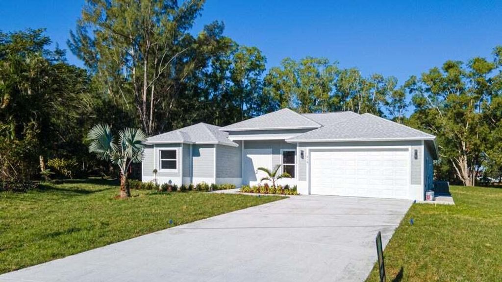 Photo of 419 SW Namoit Place, Port Saint Lucie, FL 34953 (MLS # R10952616)