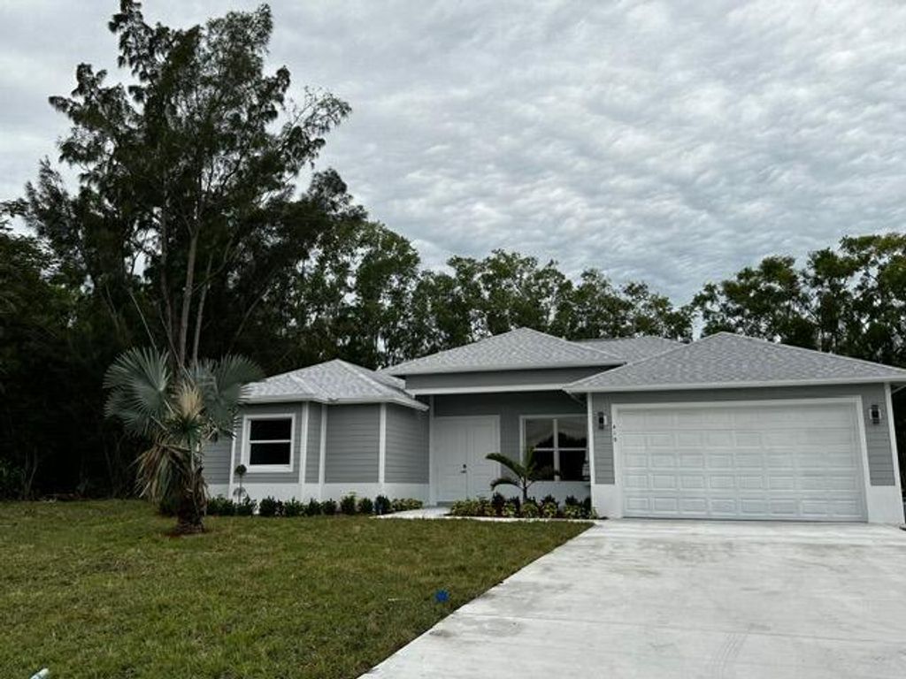 Photo of 419 SW Namoit Place, Port Saint Lucie, FL 34953 (MLS # R10952616)
