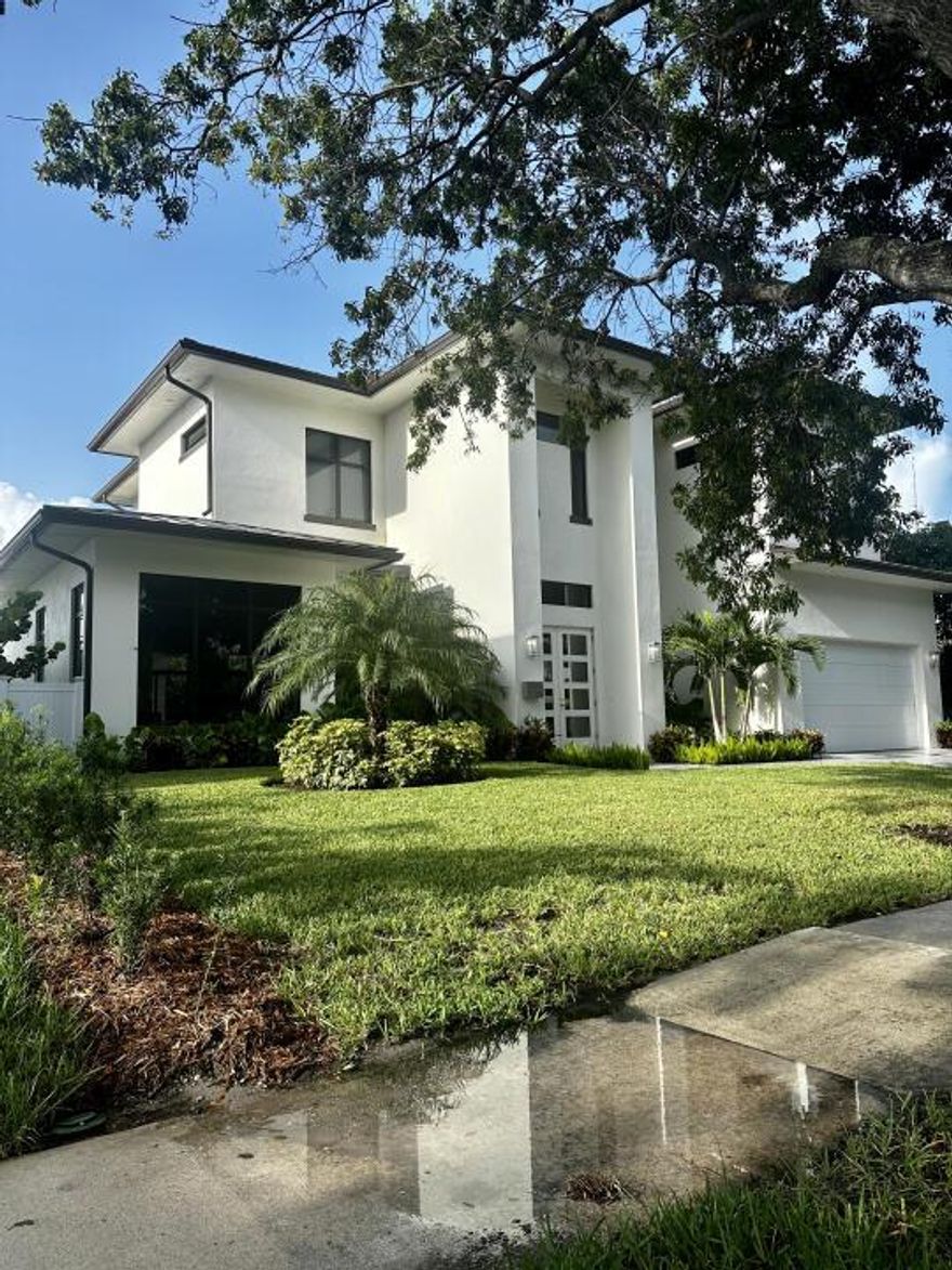 Experience a stunning 4-bedroom home on a tree-lined SoSo street. Close to S Flagler Dr, South Olive Park, Palm Beach Island, golf courses, dining, and the beach. This airy home offers open spaces, high ceilings, large bedrooms, a loggia with a grill, heated pool, laundry room, and a 2-car garage. The 1st-floor primary bedroom has pool views. Upstairs, a VIP Suite, 2 guest bedrooms, and a media suite.
