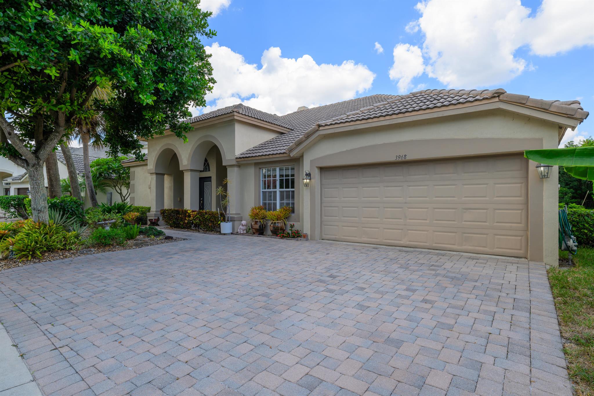 Conveniently located just off Jog Road, north of Okeechobee Blvd, it provides easy access to the Florida Turnpike and proximity to both Wellington and the vibrant nightlife of CityPlace & Clematis. This home features a functional fireplace--yes, we're in Florida, but during the fall, it becomes a cozy centerpiece for your holiday decor. The generous lot offers plenty of space to create your dream backyard, whether that means adding a pool, a pergola for intimate gatherings, or fencing for added privacy . The concrete tile roof, now 20 years old, still has decades of life left, with a typical lifespan of 30-50 years. For peace of mind, the home is currently insured with one of the top carriers in the industry.