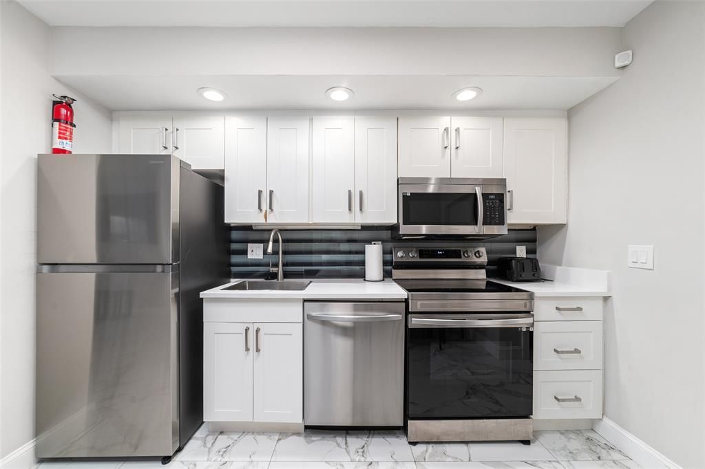 Photo of 1477 SE 4 Avenue, Deerfield Beach, FL 33441 (MLS # R11024809)