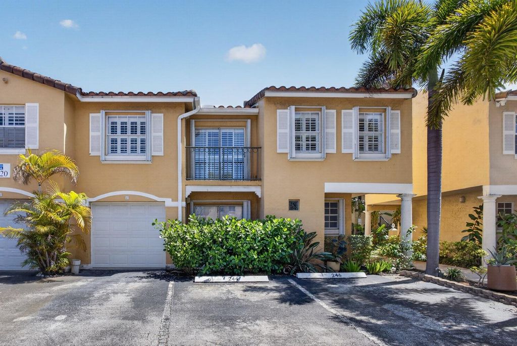 Photo of 1020 Lake Shore Drive #105, Lake Park, FL 33403 (MLS # B26022088)
