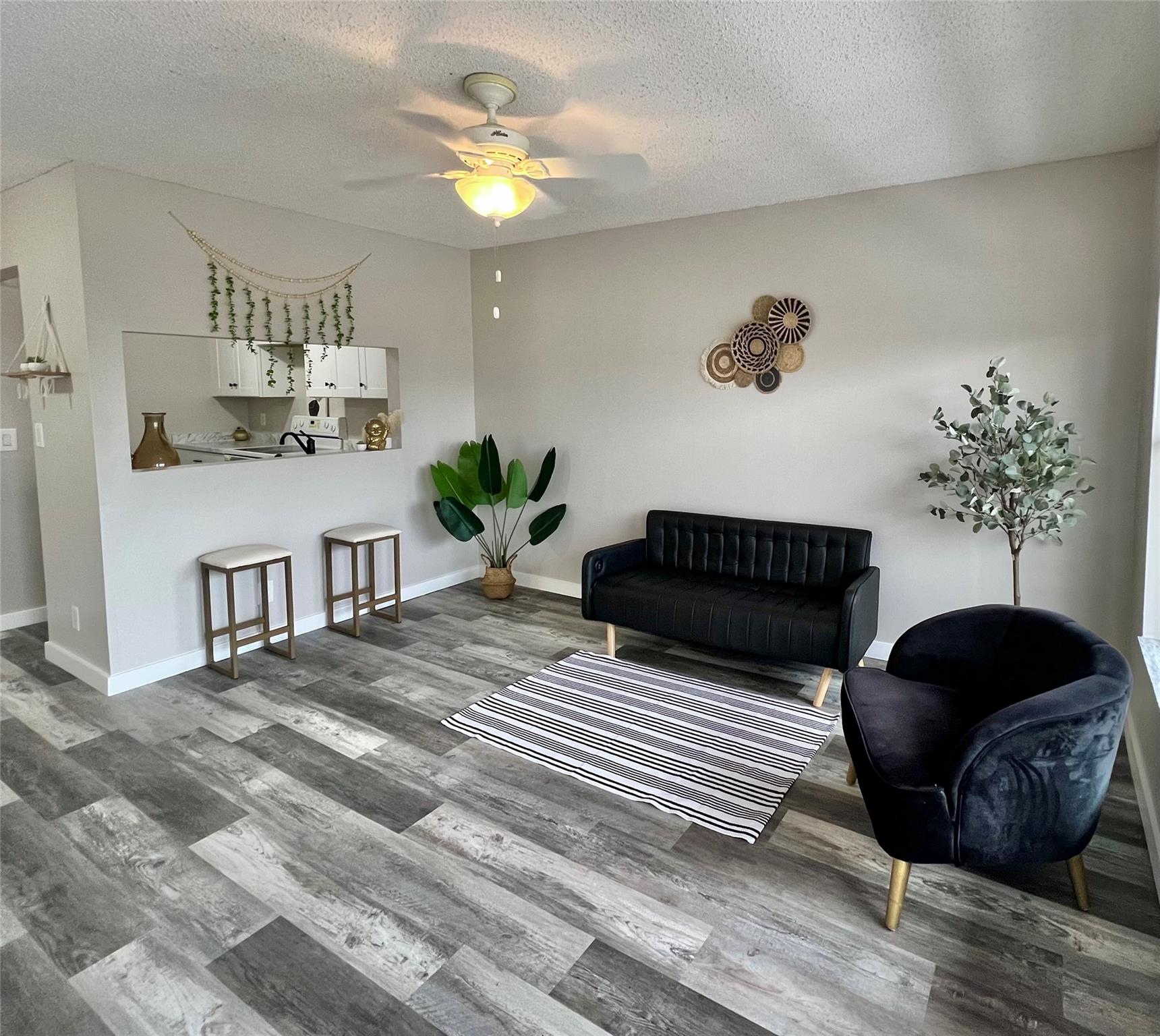 Beautiful 2-bedroom, 2-bath NEWLY RENOVATED top floor unit located in the highly desirable Winding Lake community in Sunrise. This unit features a full-size in-unit washer and dryer! New white shaker cabinets, matte black pulls, new flooring throughout, custom mirrors and more! Maintenance covers all amenities, including roof repairs, building exterior, cable TV, water, trash, landscaping, pool, and tennis courts. Perfectly situated near restaurants, entertainment, schools, and much more. This quiet, well-maintained community is surrounded by lush winding lakes and roads, ready to welcome you home. Association requires a 650 credit score and no renting during the first year, however able to absorb lease with current renter.