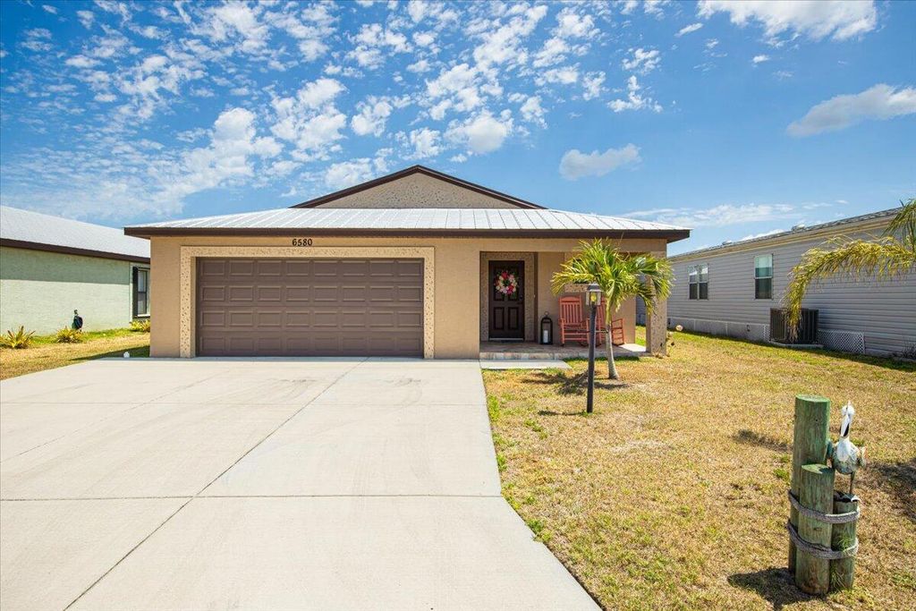 Photo of 6580 Dulce Real Real, Fort Pierce, FL 34951 (MLS # R10978044)