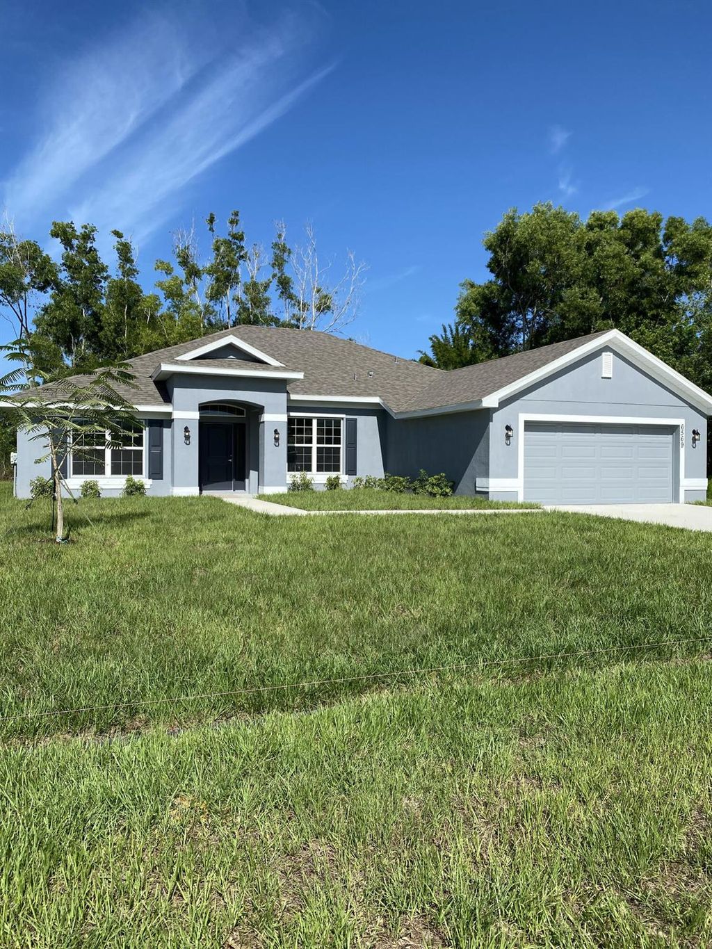 Photo of 6569 NW Omega Road, Port Saint Lucie, FL 34986 (MLS # R11015957)