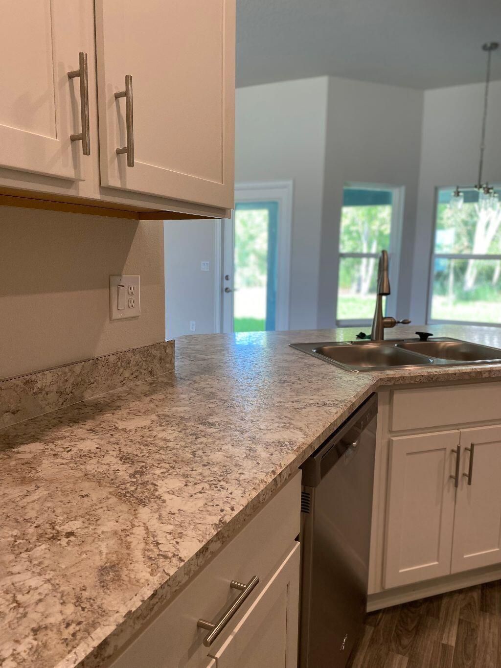 Photo of 6569 NW Omega Road, Port Saint Lucie, FL 34986 (MLS # R11015957)