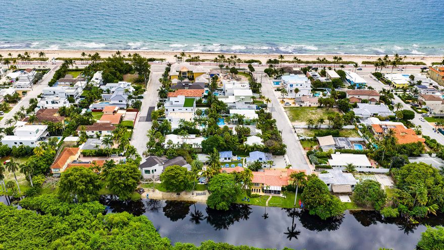 A Modern Coastal Home nestled in the prestigious Las Olas by the Sea beachside neighborhood, this exceptional residence is ideally situated between the serene lagoon of Hugh Taylor Birch State Park and the sparkling waters of the Atlantic Ocean. Just a short distance away, you will find pristine sandy beaches along the Atlantic shoreline. This rare offering is one of only a handful of properties located so close to the beach, combining exclusivity, natural beauty, and convenience. The property is a 5-bedroom, 4-bath, and a den, featuring an expansive motor court and a lush, landscaped garden that leads to a detached guest house offering added privacy and flexibility for visitors or extended family.  Additional highlights include a den ensuite, a comfortable and versatile area, ideal for a relaxed coastal office, featuring its own private entrance, used as a casual lounge, or a private retreat. This flexible area enhances the home's livability. Among its numerous highlights, the one that truly sets this property apart from others is its 48 feet of exfiltration trench installed as a special drainage system to prevent flooding, suggested and permitted by the City as part of the interlocking Belgard brick and marble project of the expansive motor court project. The relaxed elegance of this home has an open floor plan, with impact windows that let in lots of light. This property is a smart home with lights, sprinklers, door locks, cameras, a security system, and a thermostat, all possible to be controlled remotely. Shown by appointment.