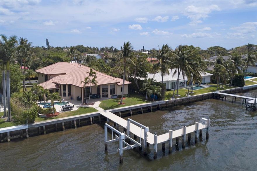 106 +/- feet of direct intracoastal ,west facing home located on secluded Hypoluxo Island.  Recently renovated and updated kitchen, baths, dock, seawall and many other features, call for details. Large 1st floor Master bedroom  with 2 full bathrooms.  Incredible 20 ft high ceilings throughout 1st floor! The 2nd floor features 3 bedrooms en-suites. Private boat dock with lift (18K lbs) & electric.  Redone pool area with spa, summer kitchen,cabana bath, lawn all overlooking the water and amazing sunsets. Truly a must see!
