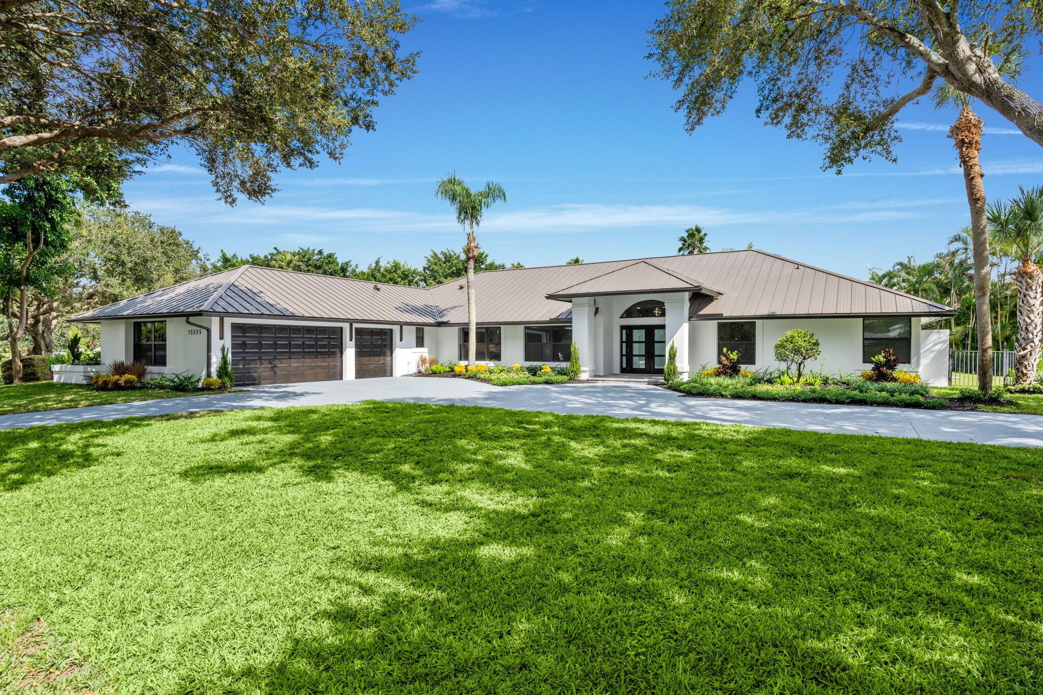 In the heart of Wellington's prestigious Aero Club, this completely renovated single-story estate sits on a private 1.05-acre corner lot. Featuring 5 bedrooms, 3 baths, and over 3,300 sq. ft. of living space, the home showcases a split floor plan with a brand-new kitchen, designer bathrooms, new roof, impact windows and doors, plumbing, electrical, new A/C, and water heater. Outside, the property is fully fenced and enhanced with a renovated pool, epoxy-finished 3-car garage, upgraded sprinkler system, fresh landscaping, and new interior/exterior paint. Move-in ready and ideally located just minutes from top-rated schools, world-class equestrian venues, shopping, and dining, this estate offers the perfect balance of privacy, convenience, and luxury living.