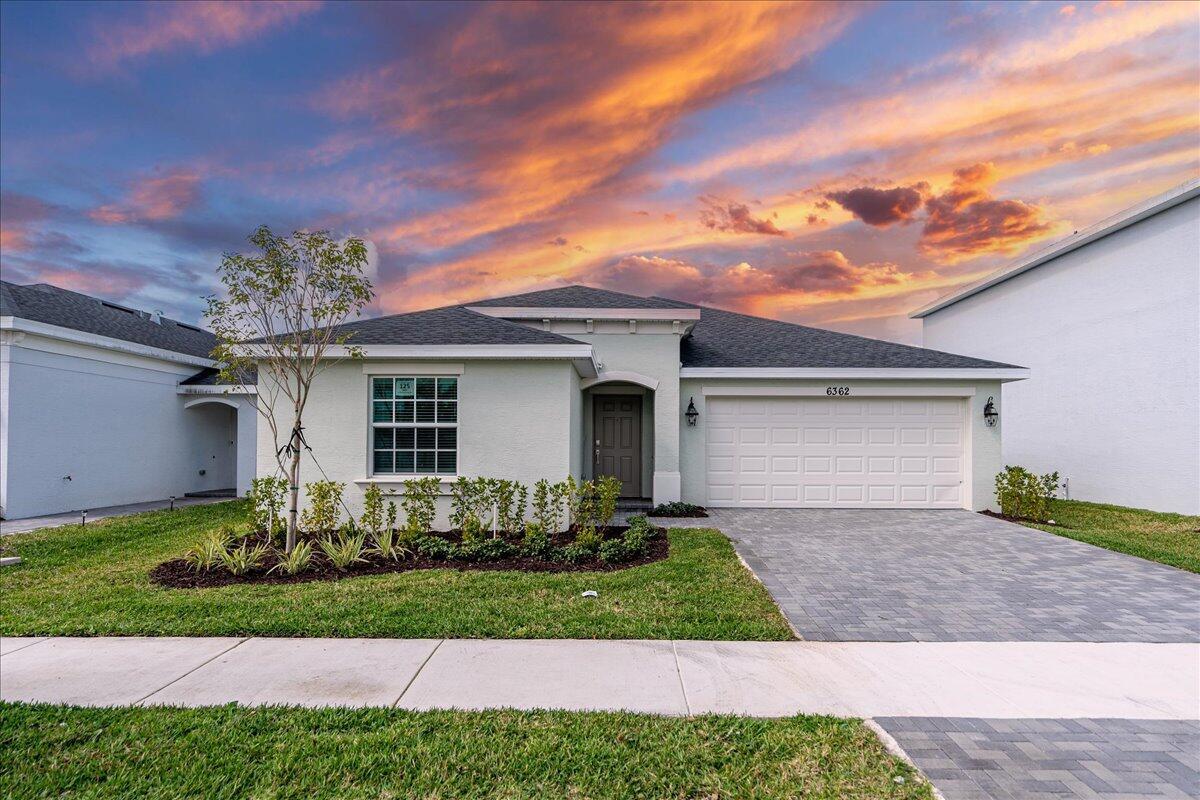 Brand New, Never Occupied 4-Bedroom Home! This stunning 4-bedroom, 2-bath home offers an open-concept layout, seamlessly connecting the kitchen, dining, and living areas. The owner's suite is ideally located in the back corner of the home with an en-suite bathroom. One of a kind corner lot with a ready-to-use patio overlooking the lake. The home includes a convenient two-bay garage, stainless steel appliances, a gas range, quartz countertops, upgraded light fixtures and a Ring doorbell system. *Located in a gated community with a beautiful clubhouse, fitness center, community pool, pickleball courts, playground, and more! Hurry and grab this perfect corner lot and make this house your beloved family home!