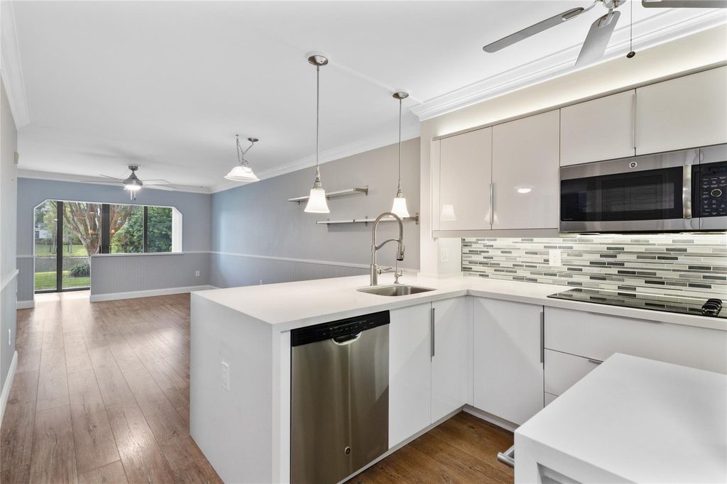 Photo of 2236 N Cypress Bend Drive #101, Pompano Beach, FL 33069 (MLS # F10455236)