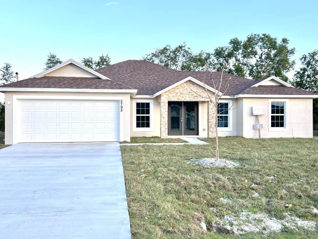 Photo of 5795 NW Coosa Drive, Port Saint Lucie, FL 34986 (MLS # R10956965)