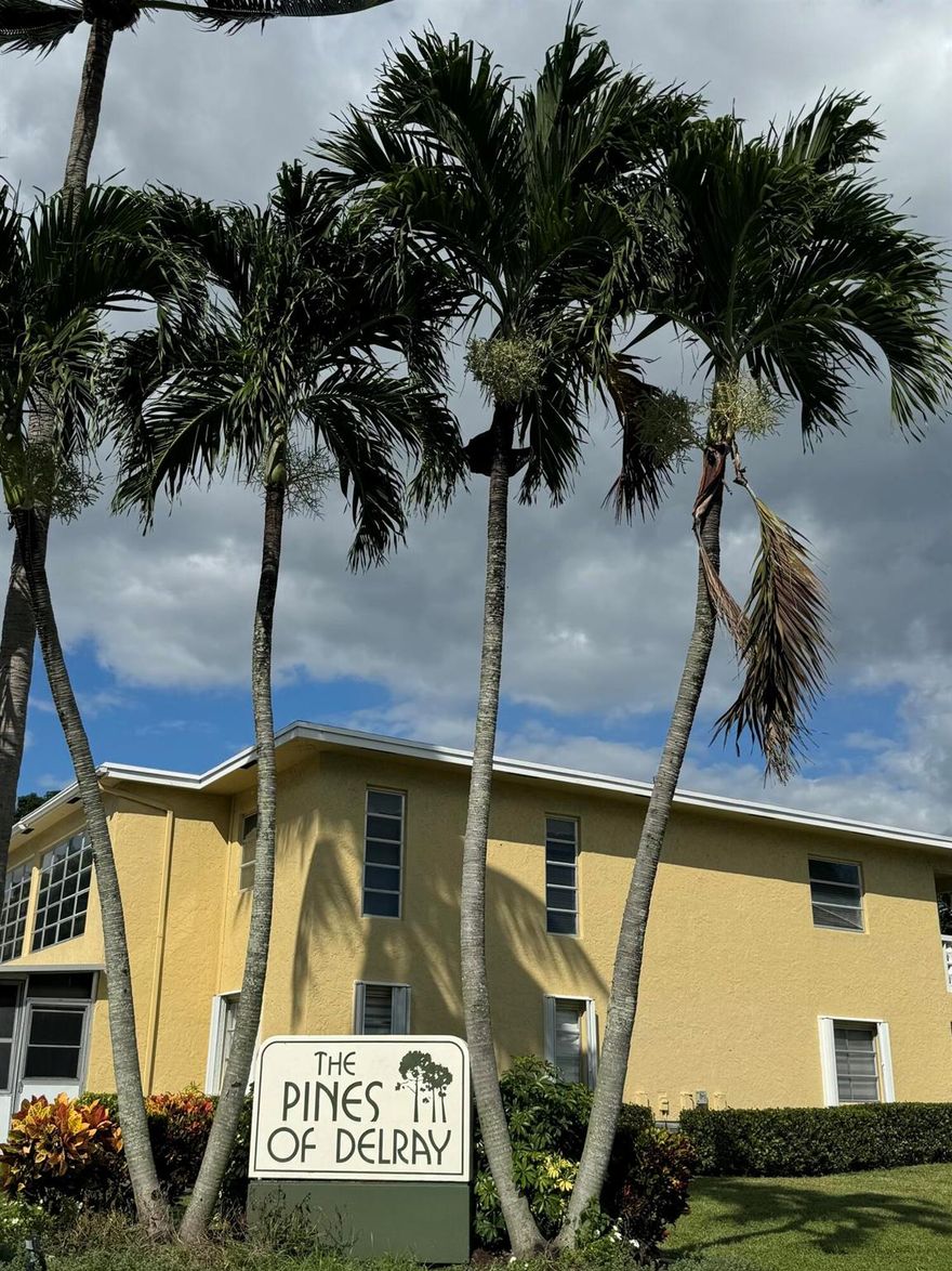 TRANSFER Of LOVE ~ Beautiful 2 bedroom, 2 bathroom condo located in the Pines of Delray. This 2nd floor condo features a screened-in balcony perfect for relaxing. Hurricane impact glass throughout and plantation shutters for comfort and peace of mind. The kitchen is equipped with new stainless steel appliances and granite counter tops. The spacious primary bedroom features 2 walk-in closets for ample storage. Designated parking spot. The Pines of Delray amenities includes 2 swimming pools, jacuzzi, bocce ball, tennis, clubhouse and much more. This condo is must see!