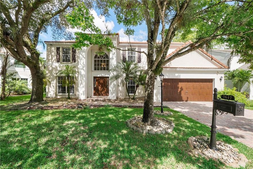 This beautifully updated home is located on a wooded preserve lot with peaceful water views!!! This popular Barton Model features a grand foyer entrance, formal living & dining rooms, family room & breakfast area. The remodeled  kitchen has new wood cabinets, granite counters, SS appliances, center island & wine cooler. All of the bathrooms have been remodeled with top of the line finishes! Other features include 20" tile flooring in the main living areas, wood laminate on the stairs & hallway, new impact front door & impact glass French doors, smooth finish walls and  ceilings, a private air conditioned office/storage space and a tastefully painted interior. Enjoy the covered patio and the screened tropical pool! A little Southern Charmer! This is truly South Florida living at its best!