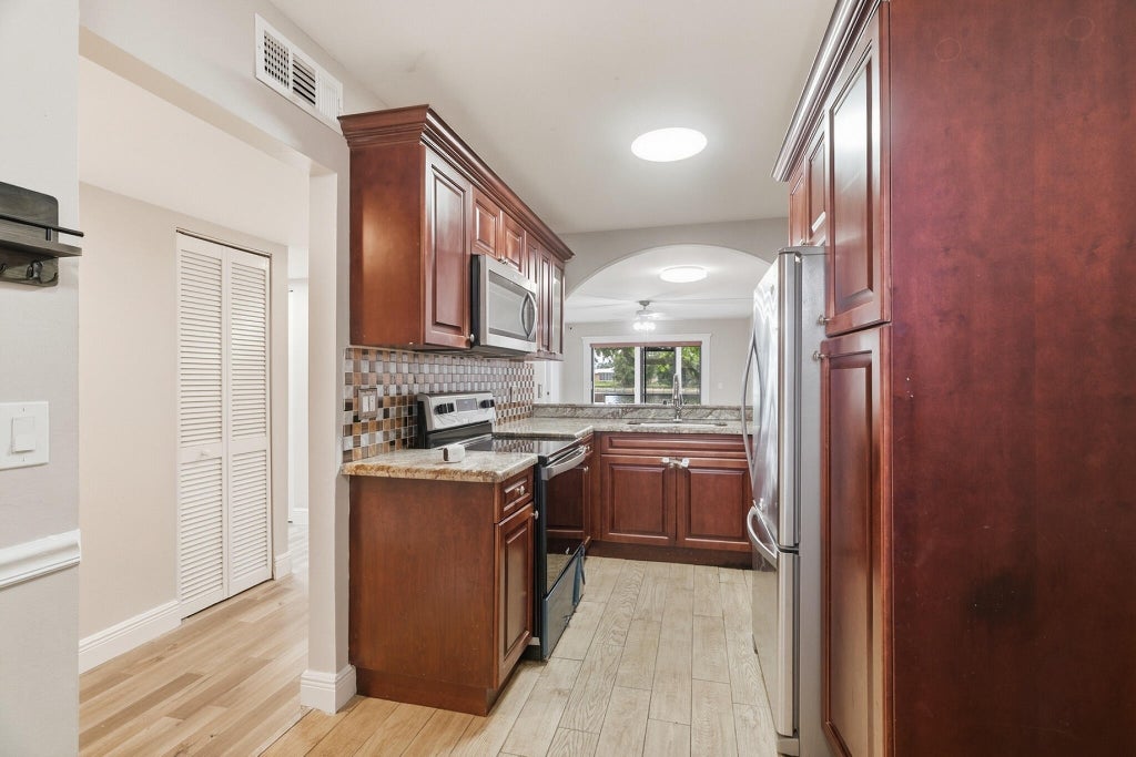 Photo of 9672 W MCNAB Road #109, Tamarac, FL 33321 (MLS # B26075921)
