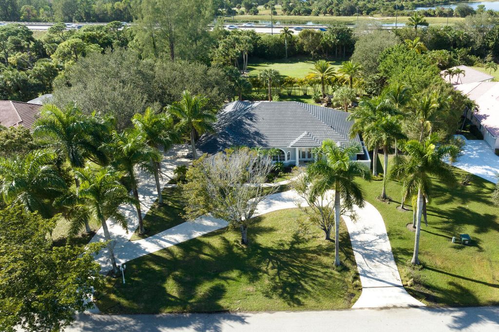 Photo of 8281 Man O War Road, Palm Beach Gardens, FL 33418 (MLS # R10938697)