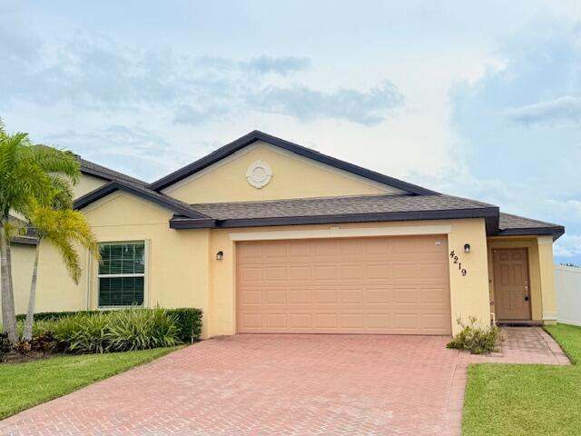 Welcome to this charming 4 bedroom, 2 bathroom, and a 2-car garage ranch style home in the newly built and desirable community of Bent Creek in Fort Pierce. Built in 2022, this move-in-ready residence boasts 1,830 square feet of open concept designed living space with a split floor plan for added privacy. Inside, you'll find a modern interior with stylish finishes, including tile and luxury laminate flooring throughout. The kitchen is equipped with stainless appliances, quartz countertops (including large kitchen island), and wood cabinetry. Both bathrooms have been upgraded with luxury vanities, adding a touch of sophistication and spa-like comfort.