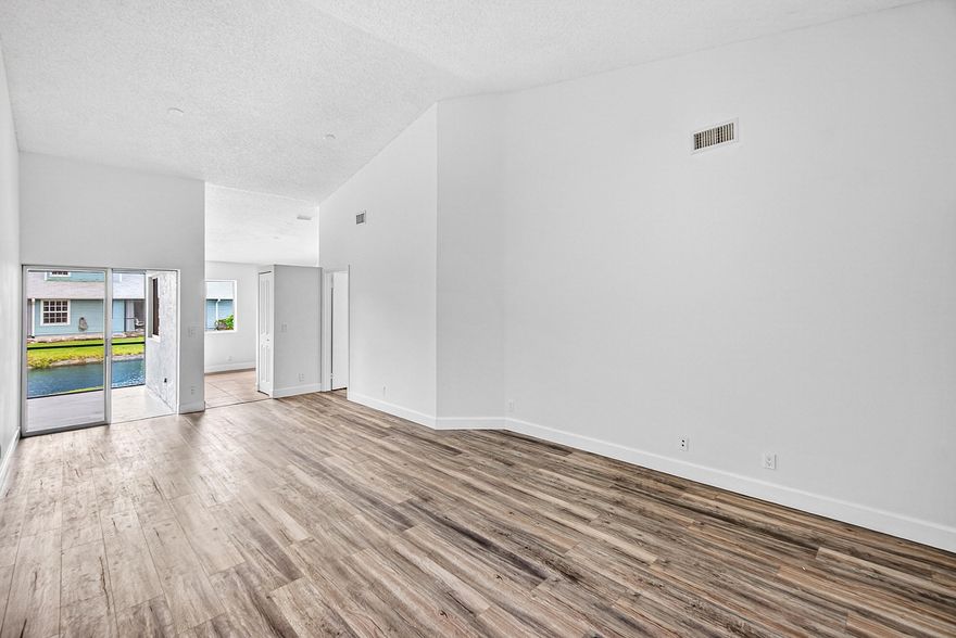 NEW RENOVATION -  NEW FLOORING, NEW KITCHEN, NEW BATHROOM VANITIES & TOILETS, FRESHLY PAINTED, NEW ROOF, GARAGE - Beautiful corner unit featuring 1 floor, 3 bedrooms, 2 bathrooms and a lake view. This is a quaint all-age community. Private garage & pet friendly. The association fee includes Building Insurance(Exterior), lawn care, pool.