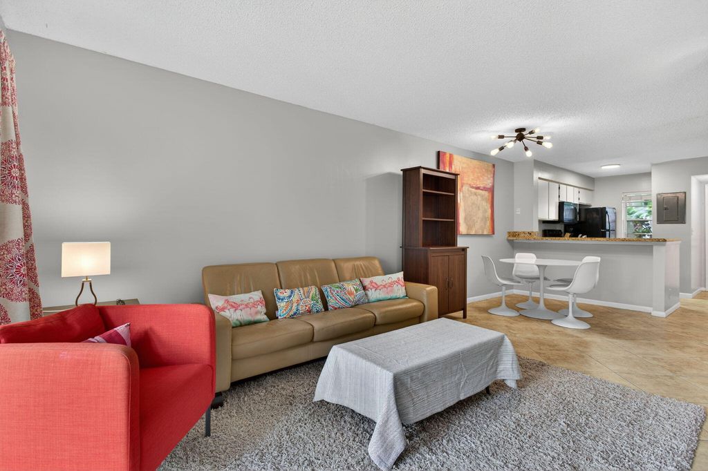 Photo of 2230 N Cypress Bend Dr N #104, Pompano Beach, FL 33069 (MLS # B26001019)