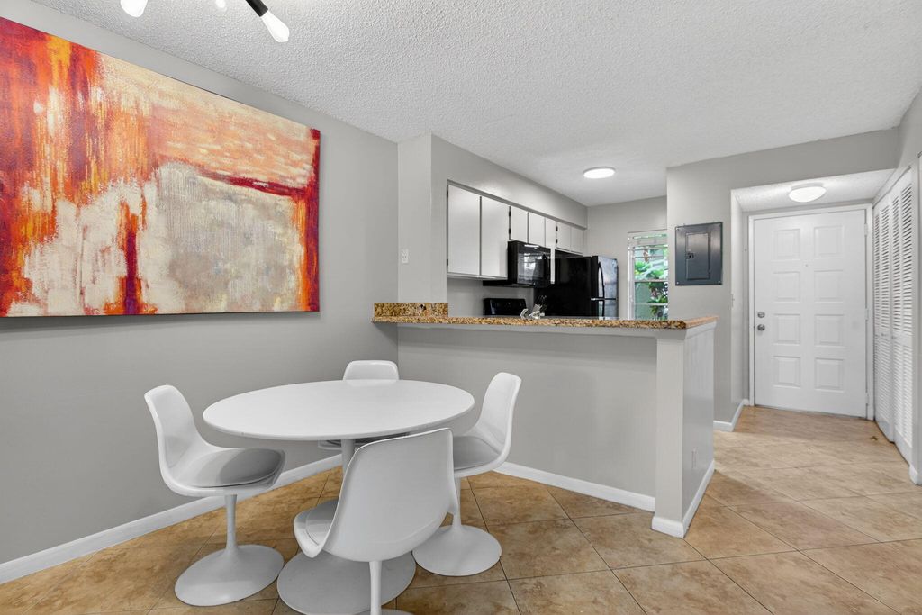 Photo of 2230 N Cypress Bend Dr N #104, Pompano Beach, FL 33069 (MLS # B26001019)