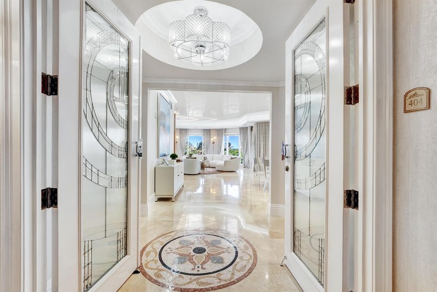 Welcome to this exceptional three-bedroom, three-and-a-half-bathroom condominium at 1 North Ocean Drive, a newly renovated residence nestled in a prestigious boutique building. Offering an impressive 3,318 square feet of elegantly designed living space, this corner unit features a wrap-around balcony showcasing sweeping ocean views and basks in abundant natural light throughout the day.Step off the private elevator through double doors into an inviting open floor plan, adorned with unique stretched ceilings that enhance the sense of space and sophistication. The gourmet kitchen, equipped with top-of-the-line appliances, overlooks the expansive living areas, ideal for entertaining and relaxed living. Every detail radiates luxury, from the pristine marble and real wood flooring to the