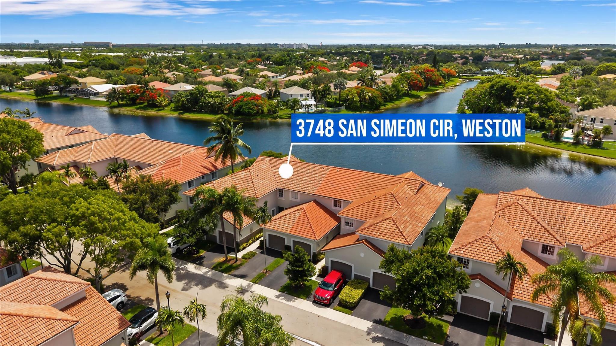 Enjoy one of the most BREATHTAKING LAKE VIEWS in San Simeon Community from this FULLY RENOVATED townhouse. 3-bedroom, 2.5-bath home features a gorgeous MODERN KITCHEN with stainless steel appliances, quartz waterfall countertops and custom wooden cabinetry. The primary suite offers a stylish barn door and built-in closets. The primary bathroom is designed with a frameless glass shower and a luxurious shower panel tower system. Jack & Jill bathroom with a relaxing jacuzzi tub. Modern touches throughout include upgraded interior doors, recessed lighting, contemporary light fixtures and crown molding. ACCORDION SHUTTERS, AC (2024) & WH (2023). Great community with POOL & playground. Excellent location near TOP RATED SCHOOLS. A move in ready gem with unbeatable lake views! MOTIVATED SELLER!