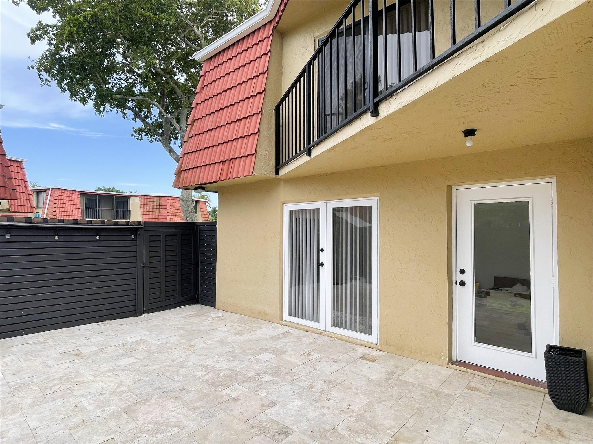 Welcome to your next home in Central Boca Raton! Located in a serene, family-friendly neighborhood, this fully remodeled corner townhome combines modern finishes with everyday comfort. Boasting two spacious bedroom balcony suites, this home is filled with natural light thanks to sliding glass doors in every room on both floors. The updated kitchen showcases sleek quartz countertops and flows seamlessly into a spacious living & dining area. Outside, an oversized travertine patio & private courtyard provide the ideal space for outdoor dining. Guest half bath on the main level, Washer & Dryer room, additional outdoor storage room, and Master bathroom with two separate vanities. Scenic 4-acre lake surrounded by a 1-mile walking trail. Community offers security Patrol. A-rated school district.