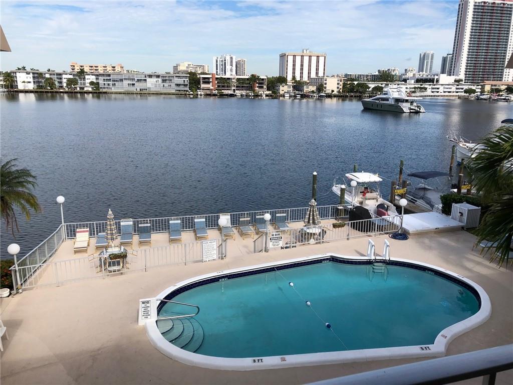 JUST REDUCED!! WELL BELOW MARKET VALUE. BRING ALL OFFERS. SEE BROKER REMARKS FOR BUYER AGENT DETAILS. BEAUTIFUL CORNER UNIT ON THE INTRACOASTAL WITH WATER VIEW ON 3 SIDES! Stunning view from pool right on the water. Fish from your front yard off the dock, enjoy the scenery. Fully furnished available with brand new sectional couch. Quiet 55+ community. Plenty of storage with 4 closets in master bed. Elevator, laundry facilities. Walk to Hallandale Beach. Skip the traffic as entertainment abounds with Gulf Stream, casino, shopping, super market and many restaurants all within .5 mile! Low cost dock available with no fixed bridges to ocean. Building just renovated. Very low unit ownership turnover. The land was recently purchased by the association so low maintenance fees with no land fee.