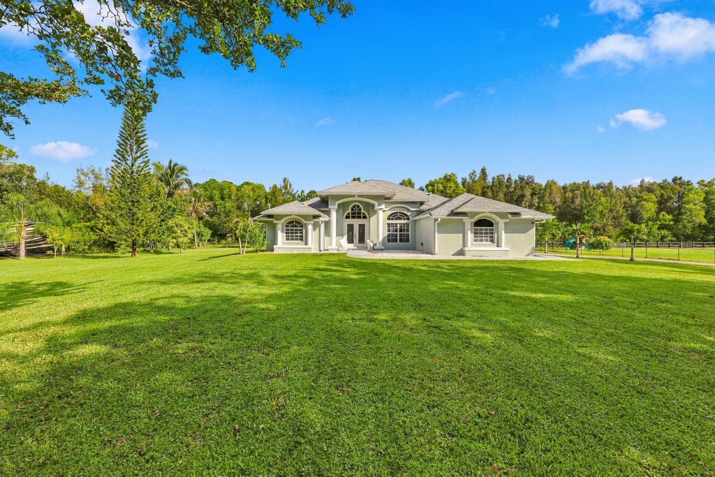 Photo of 12711 71ST Place N, The Acreage, FL 33412 (MLS # B26090084)