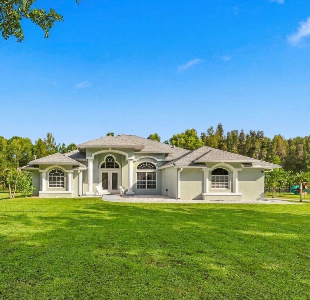 Photo of 12711 71ST Place N, The Acreage, FL 33412 (MLS # B26090084)