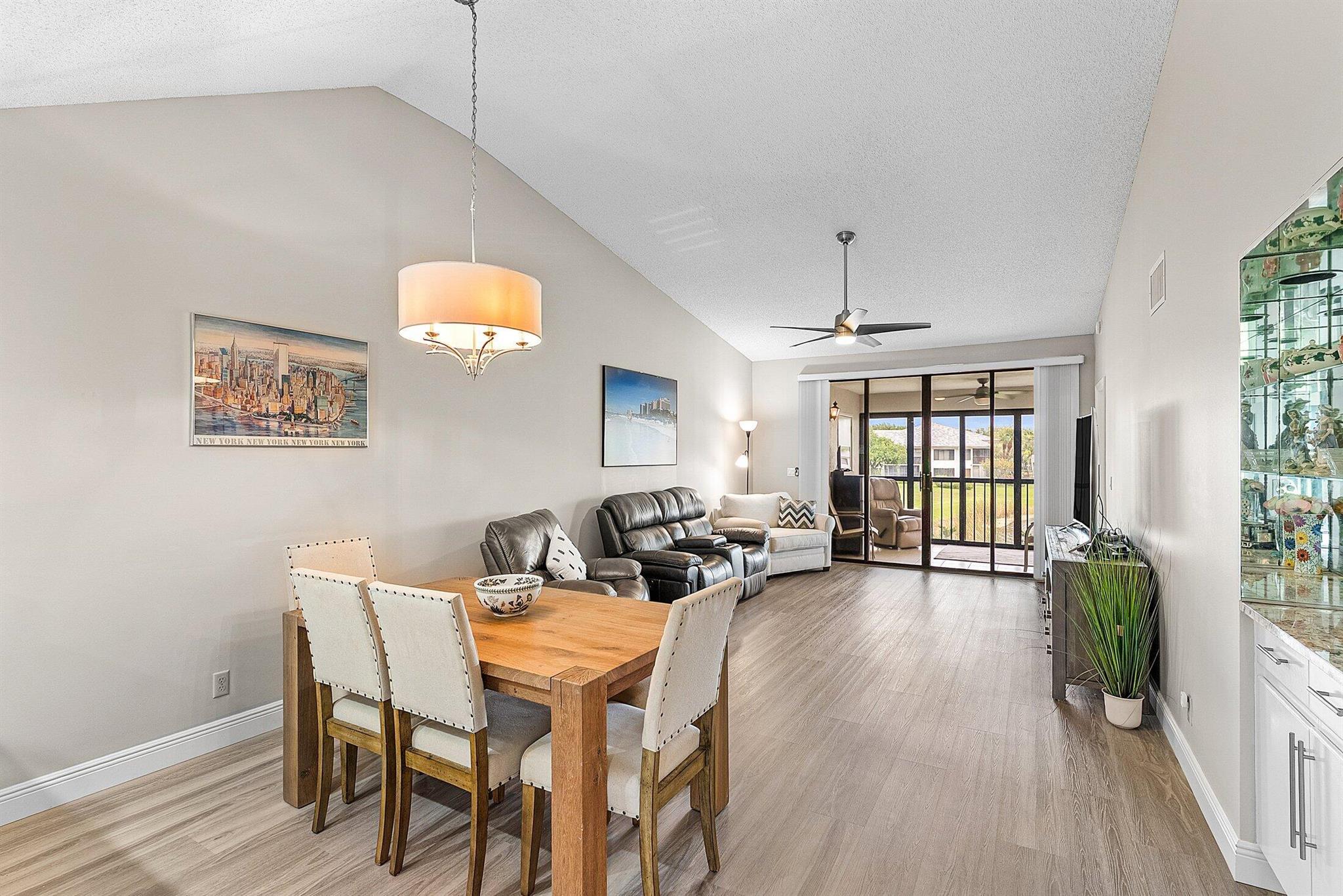 You are going to fall in love with this stunning 2 bedroom, 2 bath condo in the highly sought after Country Club of Gleneagles! This condo is nestled in a great location overlooking a sparkling lake and pool. The view is incredible. The owners spared no expense in updating this condo as it offers an updated kitchen with granite countertops, mosaic backsplash, and stainless steel appliances. There is no carpet in the condo as it has beautiful luxury vinyl plank throughout. The owners installed impact windows in the front of the condo as well! The interior floorplan is fantastic as you have split bedrooms, an eat in kitchen with an open dining room / living room. The guest bathroom has been fully upgraded.