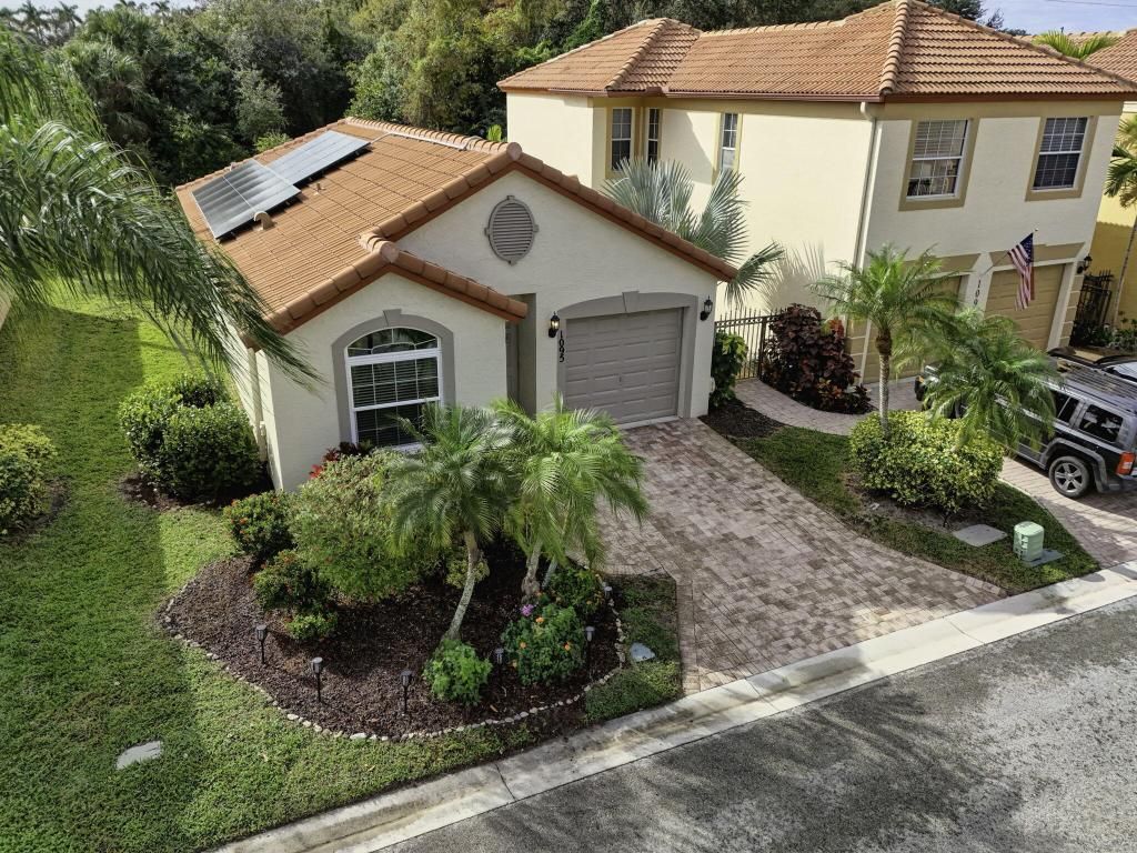 Photo of 1095 Via Jardin, Riviera Beach, FL 33418 (MLS # R11155519)