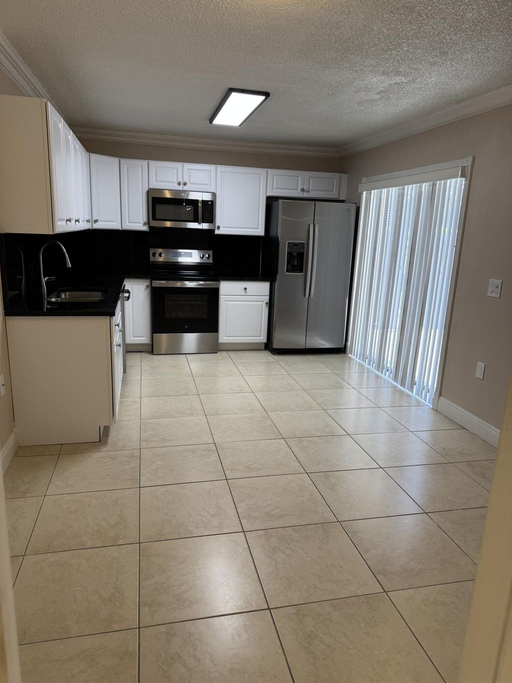 Photo of 915 9th Way, West Palm Beach, FL 33407 (MLS # B26049851)