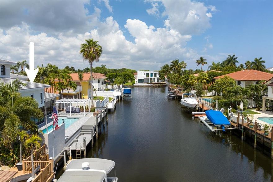 Enjoy Luxury Waterfront living in this Mediterranean Estate home w/Ocean Access in East Boca Raton. This extraordinary fully renovated 4/4 home features a new roof & impact windows & doors (2022). Walk thru the lushly landscaped private courtyard and as you enter the home you will immediately notice the light streaming in, the 2 story living room ceiling & the expansive water views. This home is made for entertaining with a fantastic new wet bar complete w/a built in wine cooler & ice maker & the all white eat in kitchen w/ gorgeous quartz counter tops and bar & new highly upgraded  Monogram kitchen appliances. As you step out to the oversized pool & patio you can imagine using your summer kitchen under the pergola & docking your boat at your own private 70 ft. dock.  More...